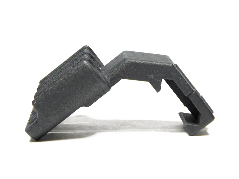 Side profile of Picatinny ammo carrier showing low-profile design under rifle scope