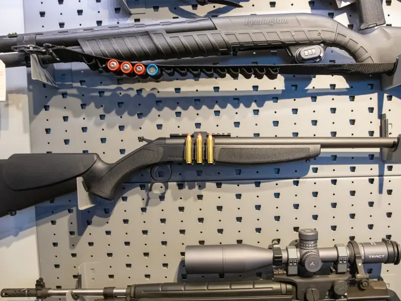 Big game hunting rifle setup with large caliber Picatinny carrier positioned for quick access