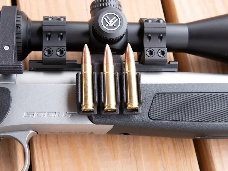 Ammo Carrier for CVA Scout Picatinny rail holding three .223 rounds on a rifle
