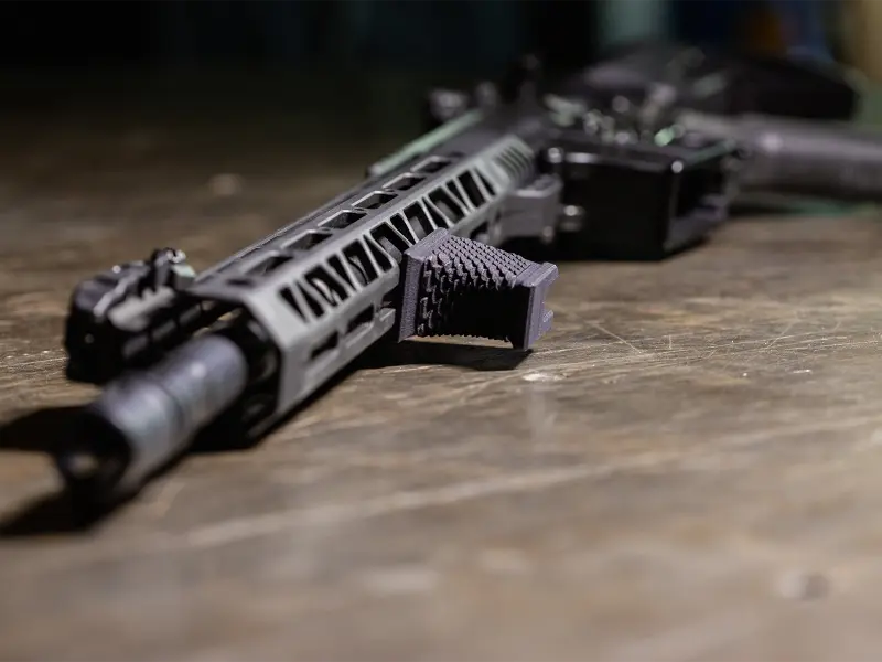 Hand Stop in use, shooter pulling rifle into shoulder