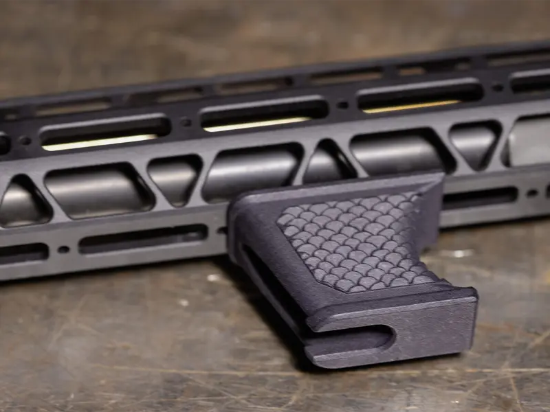 Lightweight profile of the Hand Stop on a modern sporting rifle