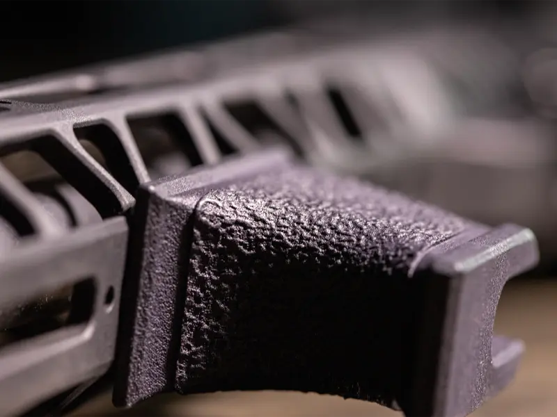 Lightweight profile of the Hand Stop on a modern sporting rifle