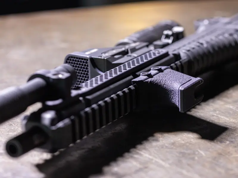 Lightweight profile of the Hand Stop on a modern sporting rifle