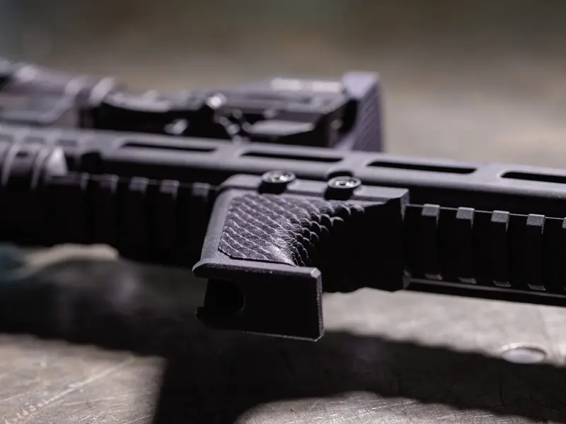 Lightweight profile of the Hand Stop on a modern sporting rifle