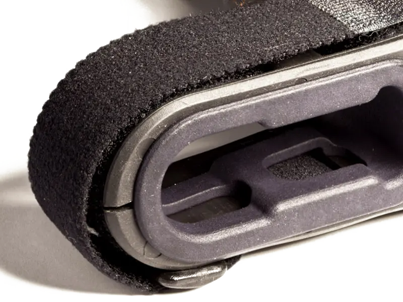 Detailed view of notched edges on SBA3 storage plug designed to work around internal brace straps