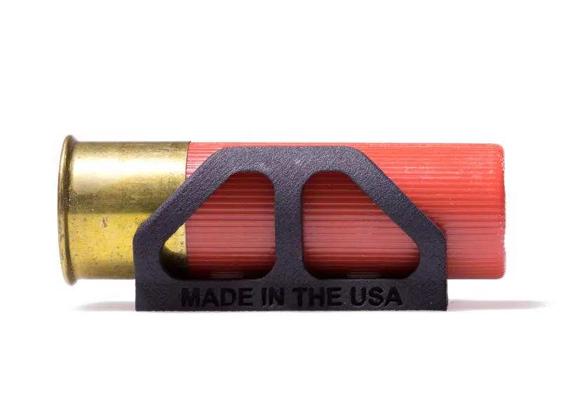 Side view of the 12 gauge shell holder attached to a shotgun