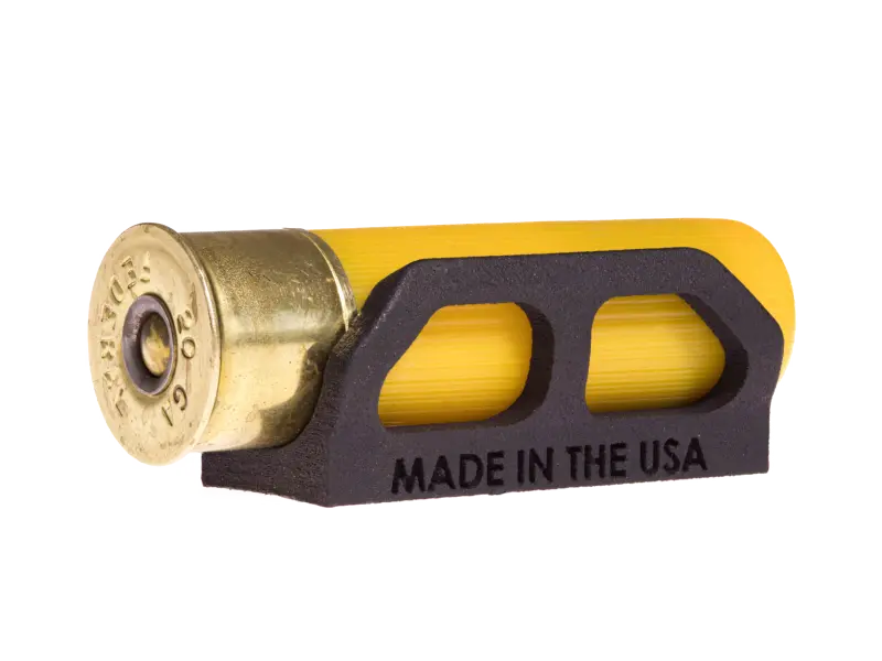Side view of the 20 gauge shell holder attached to a shotgun